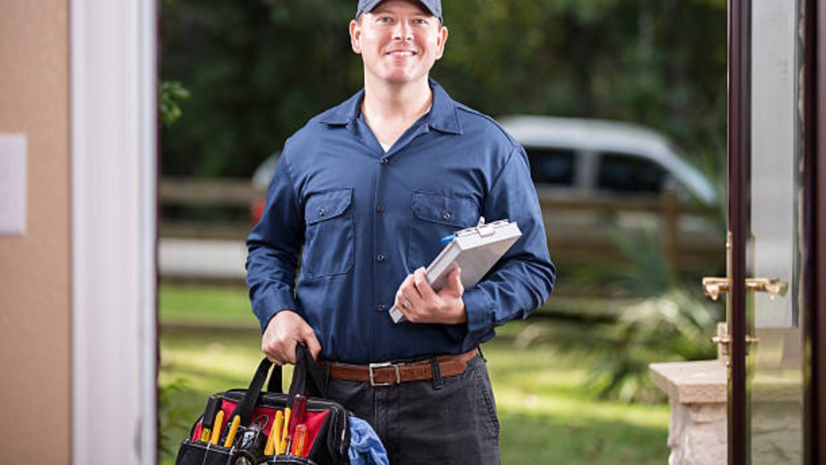 A man holding a tool bag