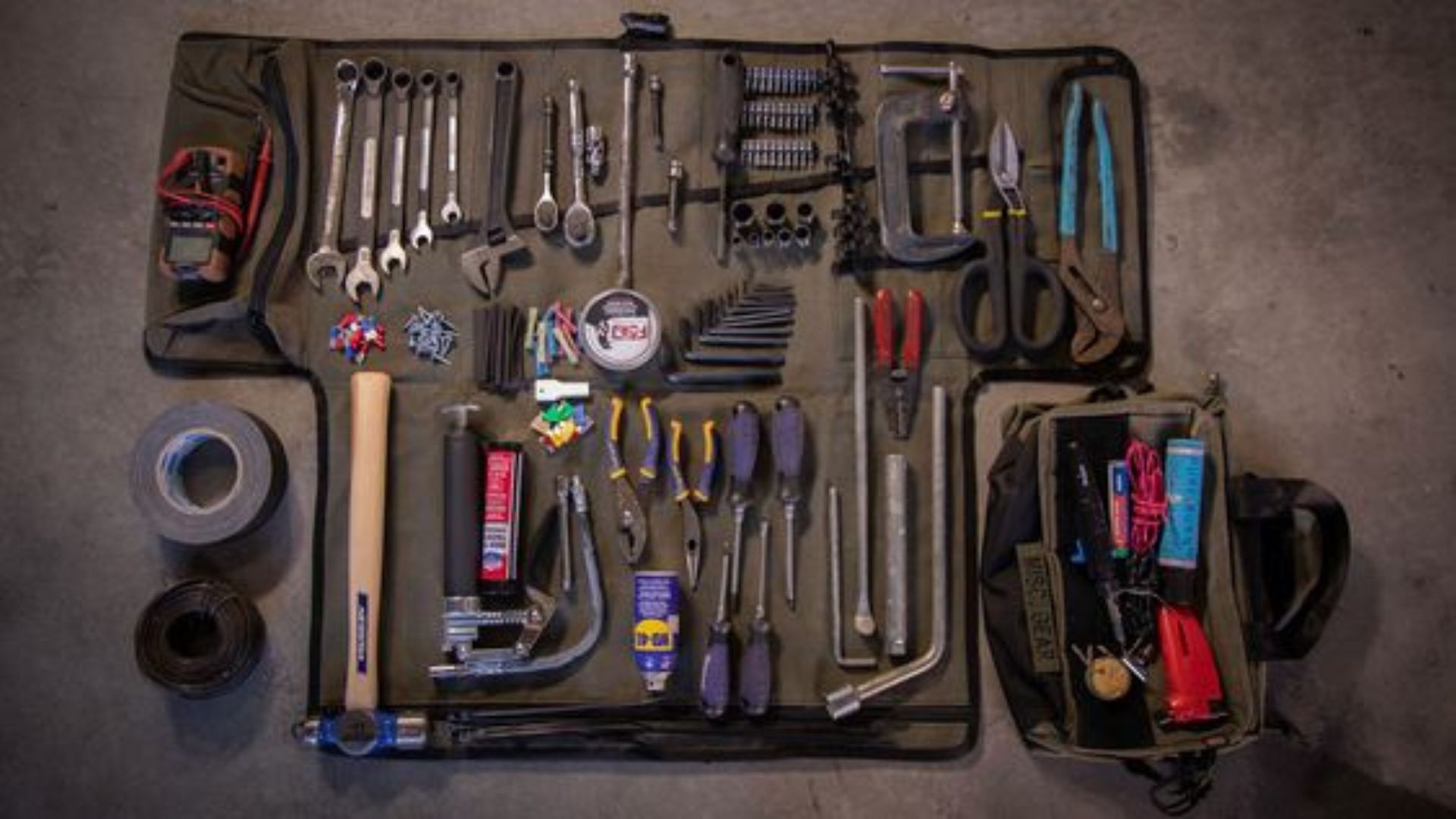 A tool bag filled with assorted tools.