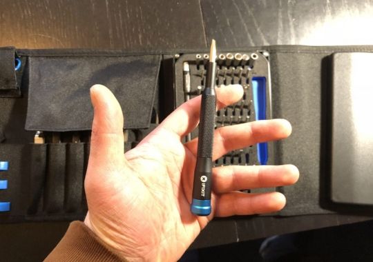 A person holding the ifixit screwdriver.